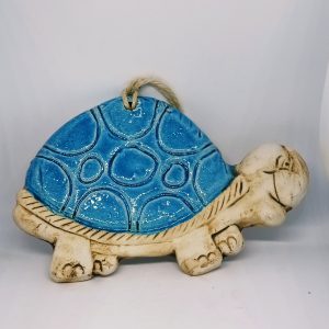 Blue and beige turtle wall hanging