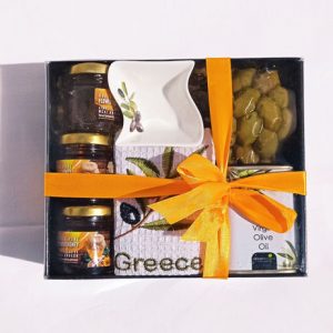 Gift box with pure honey, olives, olive oil, bowl and towel