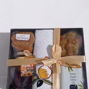Gift box with olive oil, honey, olives, towel and mix for barbeque