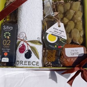 Gift box with olive oil, olives, olive oil with herbs, towel and mix for lamb