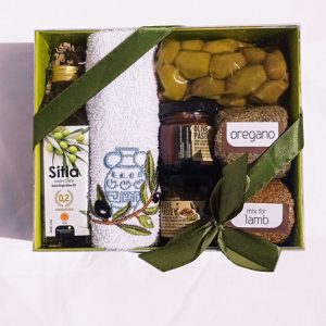 Gift box with olive oil, olive paste, olives, towel, oregano and mix for lamb