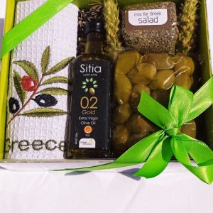 Gift box with olive oil, olives, towel and mix for salad